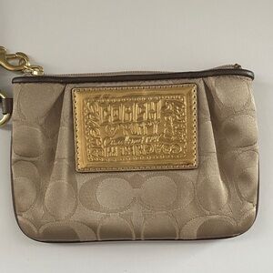 Coach Poppy Beige and Gold Embossed Wristlet
